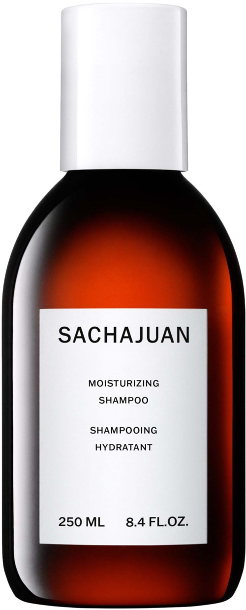 Eine braune Flasche mit weißem Deckel und Etikett, das "Sachajuan Moisturizing Shampoo" sagt.