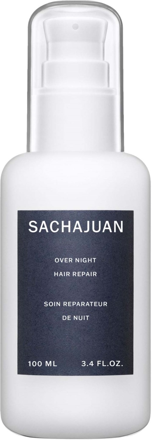 Eine weiße Flasche mit Aufdruck 'SACHAJUAN Over Night Hair Repair' und Pump, für Haarpflege.