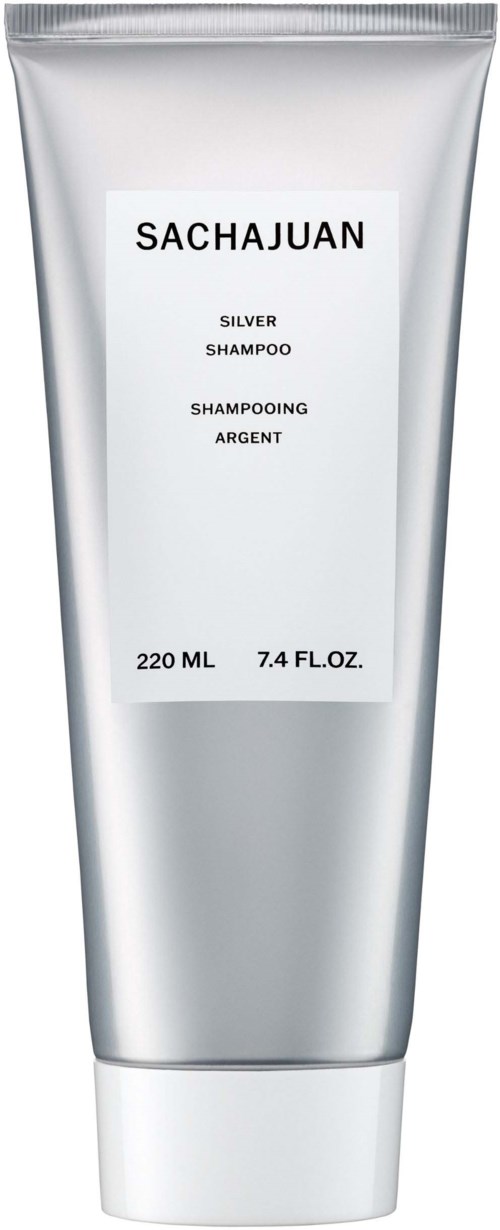 Eine silberne Shampoo-Tube mit schwarzem Text, enthält 220 ml oder 7,4 fl oz Shampoo.