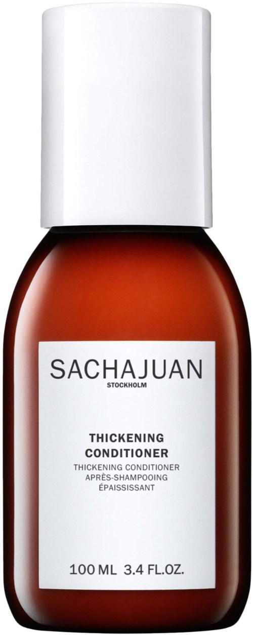 En brun flaska med vit kork och etikett, innehållande förtjockande balsam från Sachajuan.