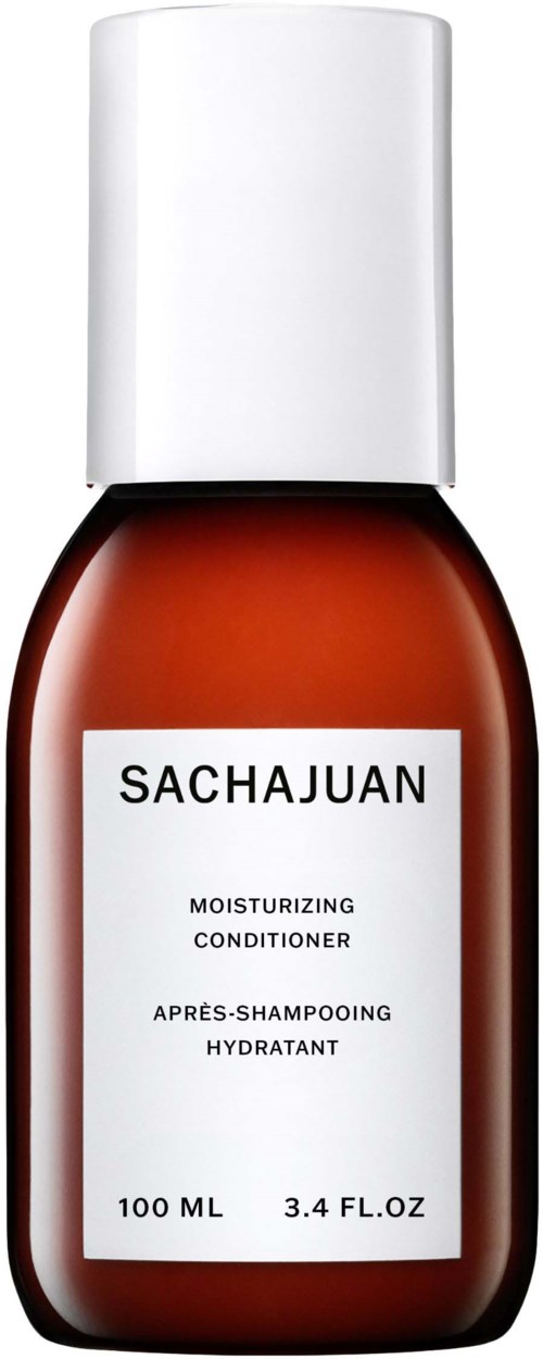 Eine braune Flasche mit weißem Deckel, beschriftet 'SACHAJUAN' und 'Feuchtigkeitsspülung' für Haar, 100 ML.