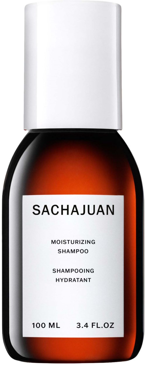 En liten brun flaska med vit kork, märkt 'SACHAJUAN' och 'Moisturizing Shampoo', 100 ml kapacitet.