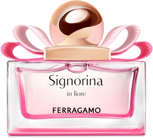 Vaaleanpunainen parfyymipullo, kultainen korkki, vaaleanpunaisia nauhoja ja teksti 'Signorina in fiore FERRAGAMO'.