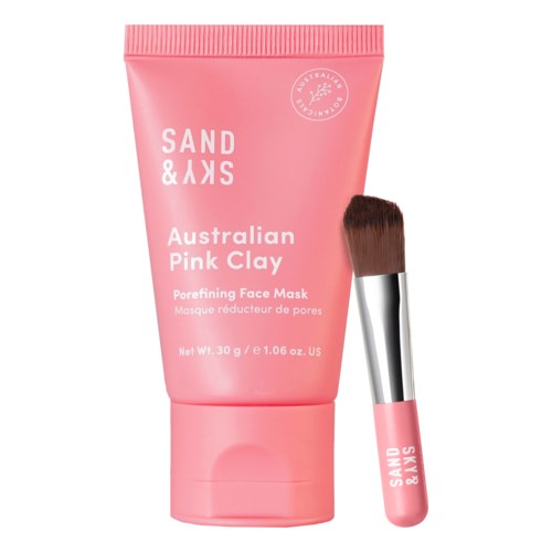 Pinkfarbige Tube mit australischer Pink Clay Gesichtsmaske und Pinsel daneben.