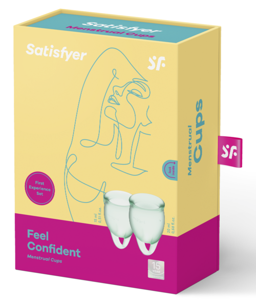 Förpackningsruta för menskoppar med en enkel linjeteckning av ett kvinnas ansikte, rosa och gula färger och produktnamnet.