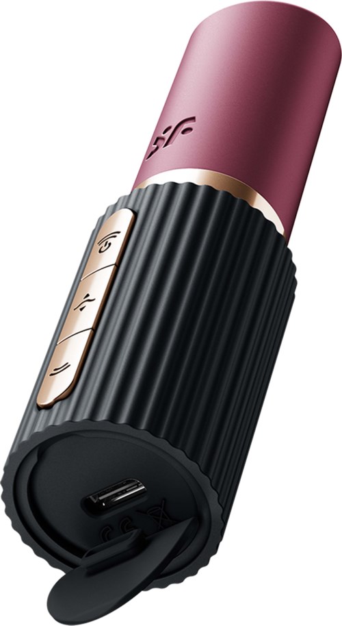 A portable speaker with a pink top, black ribbed body, and control buttons on the side.