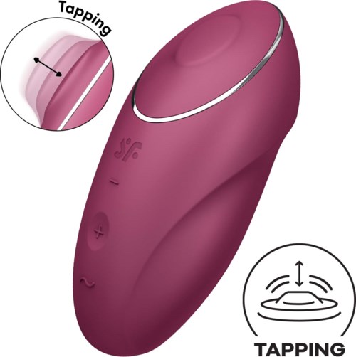 Pink device with buttons and touch area, designed for stimulation and tapping functions.