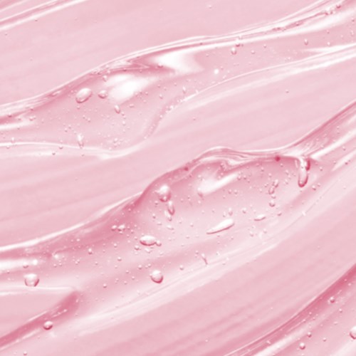 Een gladde, roterende roze oppervlak met kleine bellen en glanzende highlights, die op een vloeistof of gel lijken.