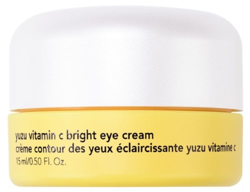 A yellow jar of eye cream with black text and a white lid. It is for brightening the eye area.