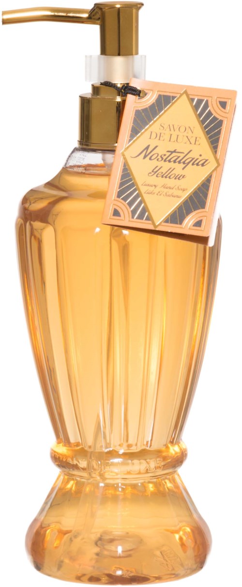 A perfume bottle with a gold pump, orange liquid, and a pink tag labeled 'Nostalgia'.