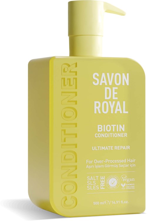 Yellow bottles with pump, labeled for hair conditioner with biotin, suitable for damaged hair, vegan and salt-free.