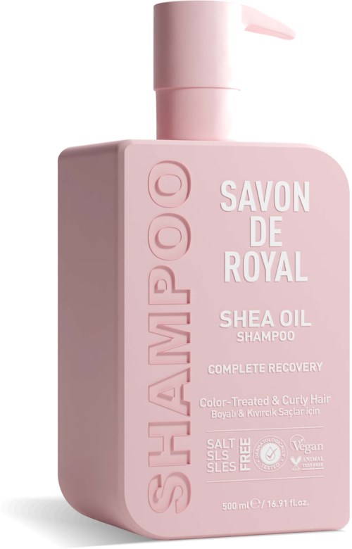 Pink shampoo bottle with pump, labeled 'SHAMPO' and 'SAVON DE ROYAL SHEA OIL.'