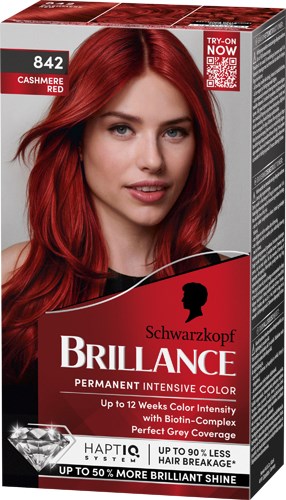 Vrouw met felrood haar op een haarverfpakkingsdoos, gemarkeerd Schwarzkopf Brillance permanente kleur.