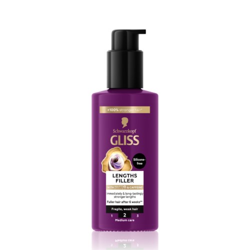 Een paarse fles haarproduct met pomp, geschikt voor lang, breekbaar haar, versterkend.
