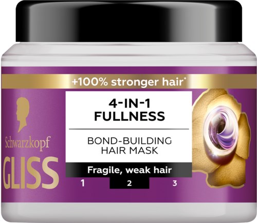 Een pot Schwarzkopf Gliss haarmasker, paars en goud label, beweert zwak, broos haar te versterken en te herstellen.