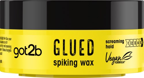 Kleine zwarte pot met gele label, tekst over vegan, lijmen en spikenvrije was, en een hold schaal.
