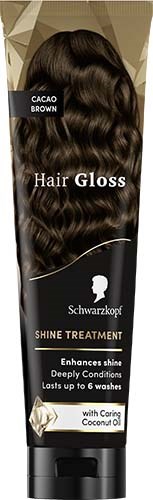 Haarverzorgingsfles met donker, glanzend, golvend haar op het label dat glans en diepe verzorging biedt. Bevat kokosolie.