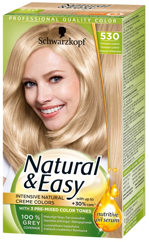 En blond kvinna med stylat hår som ler på en hårfärgningsförpackning märkt 'Natural & Easy'.