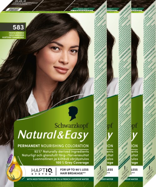 Vier Packungen Schwarzkopf Natural & Easy Haartönung mit lächelnder Frau auf der Verpackung.
