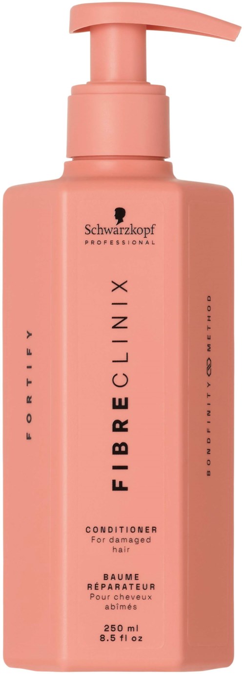 Rote Flasche mit Schwarzkopf Fiber Clinix Conditioner für geschädigtes Haar mit Pumpkopf.