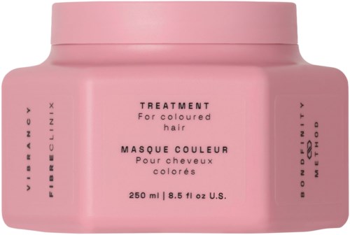 Rosa Haarpflegebehälter mit Produktdetails und Markenname. Für gefärbtes Haar.