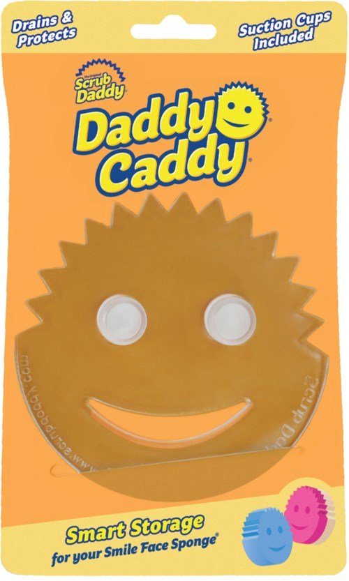 Ett skrattande ansiktsformat skrubbpad med två sugsugkoppar, i orange förpackning märkt "Daddy Caddy" för förvaring.