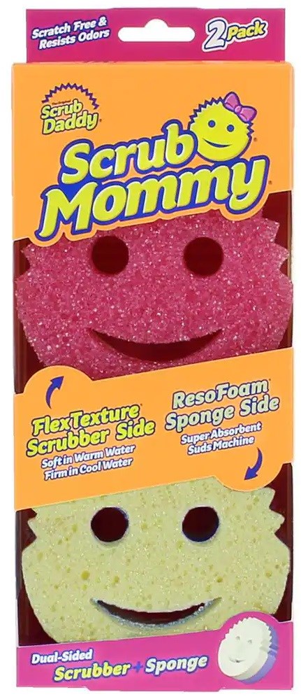 Två dubbelsidiga skurborstar med leende ansiktsdesigner, rosa och gula, i förpackning märkt 'Scrub Mommy' och 'Scrub Daddy'.