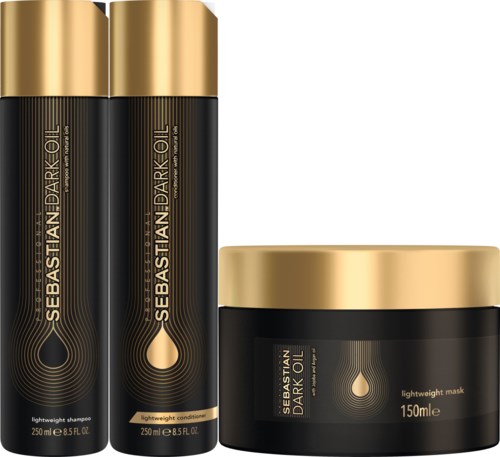 Ett hårvårdsset med flaskor med guldlock och en svart burk, märkta 'Sebastian Dark Oil', innehållande schampo, balsam och mask.