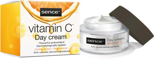 Ein Hautpflegeprodukt namens Sence Vitamin C Day Cream mit Orangensymbolen und einem offenen Behälter.