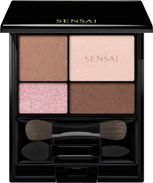 Eine Make-up-Palette mit vier verschiedenen Lidschatten in Braun-, Rosa- und Beigetönen und zwei kleinen Pinseln.