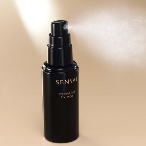 A black bottle with a spray nozzle, labeled 'Sensai Hydrating Fix Mist'.