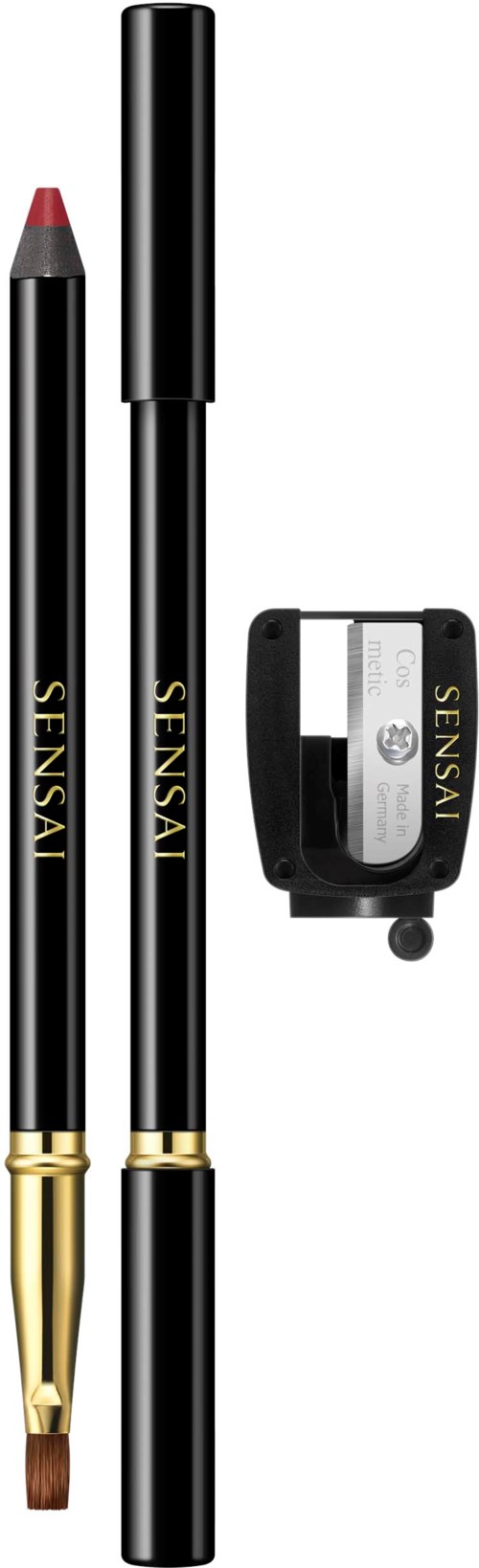 Een make-up kwast, een lippenpotlood, een mascara en een kleine zwarte case met de tekst 'SENSAY'.