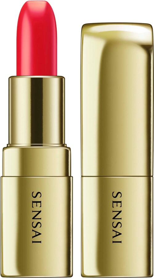 Ein goldener Lippenstift mit dem Wort 'SENS  AI' und einer sichtbaren roten Lippe.