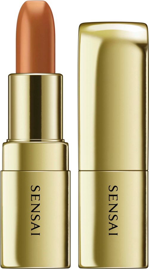 Ein goldener Lippenstift mit dem Wort 'SENSAY' und einem offenen Lippenstift in Nude-Ton.