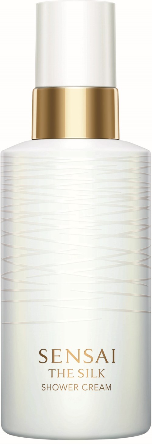 Eine weiße Flasche mit goldener Kappe, beschriftet Sensai The Silk Duschcreme.