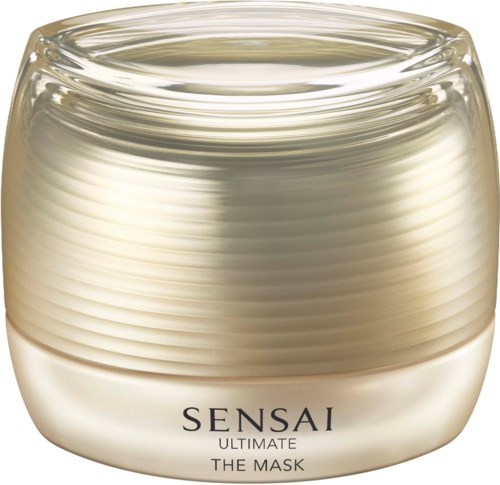 Ein Behälter mit Sensai Ultimate The Mask, Hautpflegeprodukt, cremfarben mit klarer Abdeckung, enthält eine nährende Gesichtsmaske.