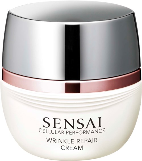 Een witte pot met een zilveren deksel gemarkeerd Sensai Wrinkle Repair Cream. De pot heeft een roze band en ribbelachtig ontwerp.