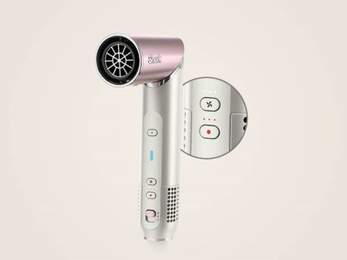 A pink and white handheld device with buttons and a circular attachment, possibly a hair dryer or similar tool.