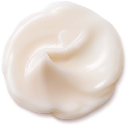 Romige witte spiraal, zachte en gladde textuur, lijkt op geklopte room of lotion.