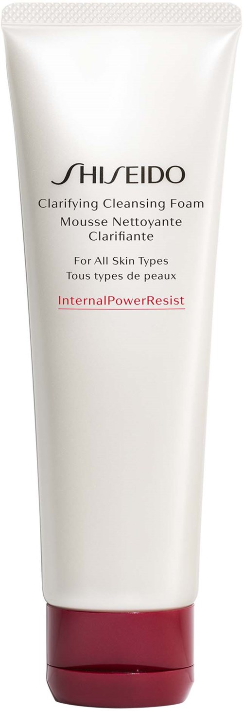 Een witte tube Shiseido Clarifying Cleansing Foam met een rode dop, geschikt voor alle huidtypen en bestand tegen interne kracht.