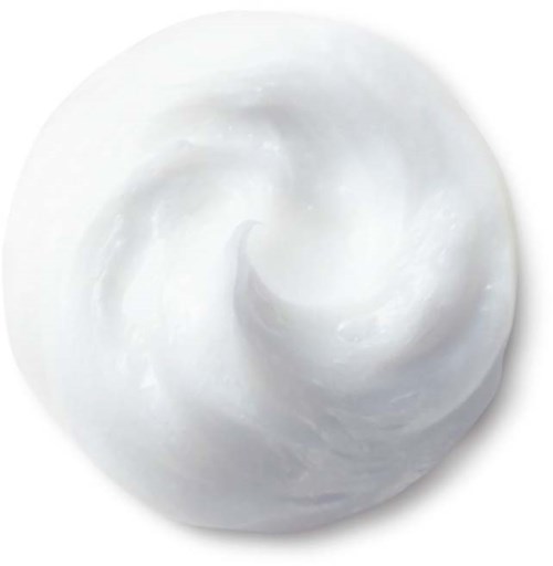 Een witte, romige, gedraaide substantie in een kleine ronde kom.