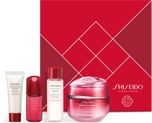 Shiseido hudvårdsset med en låda, kräm, lotion och andra flaskor, alla i röda och vita nyanser.