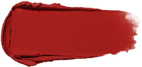 Red lipstick smear with a soft, uneven edge on a white background.