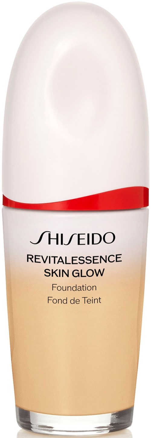 A foundation bottle with a white cap and a beige-colored body, labeled Shiseido Revitalessence Skin Glow.