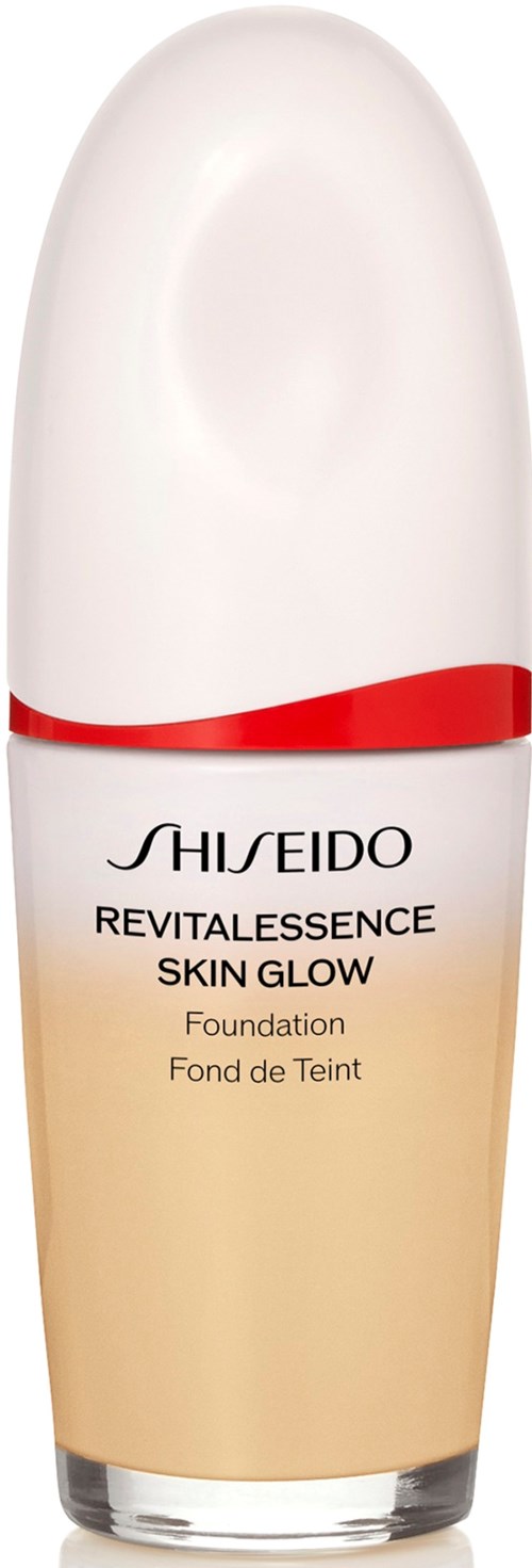 Shiseido Revitalescence Skin Glow Foundation bottle, white and beige, with red accent, labeled with product name.