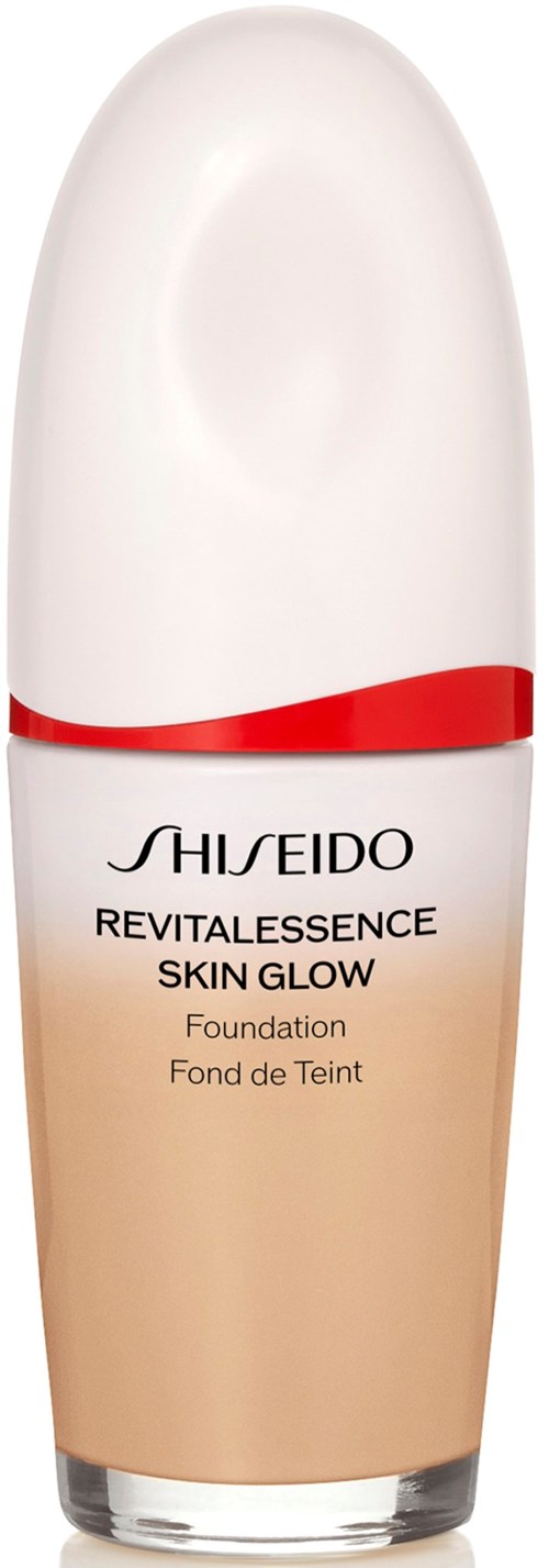 A tall, white and beige bottle with a red band, labeled Shiseido Revitalessence Skin Glow foundation.