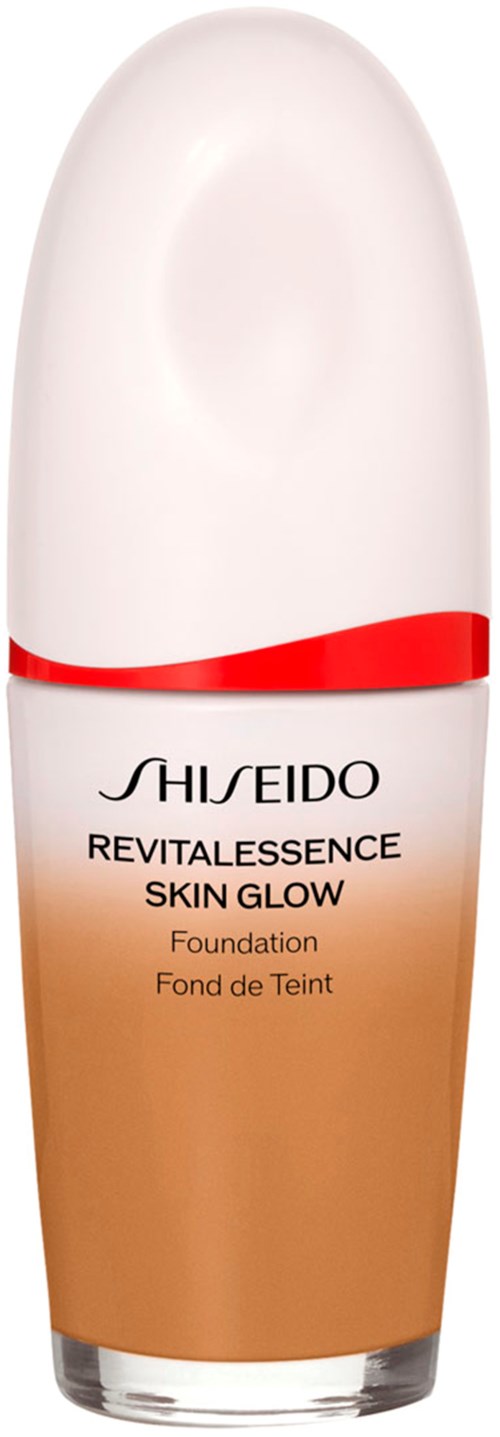 A bottle with shiseido skin glow foundation, white cap, beige liquid inside, red band near the top.