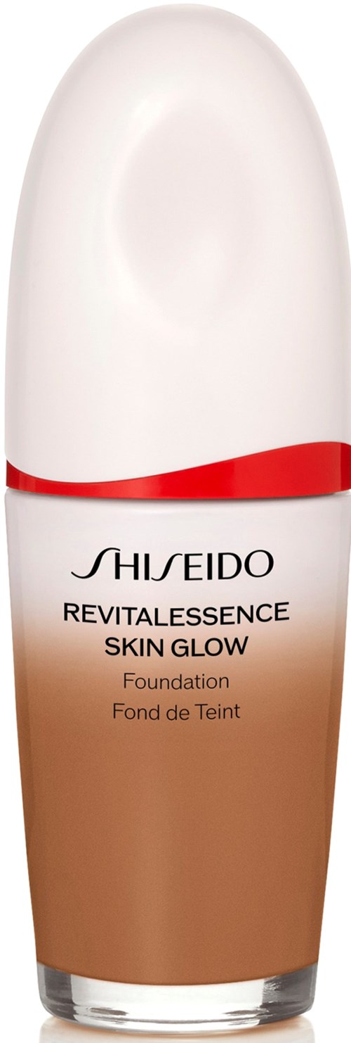 A bottle of Shiseido Revitalessence Skin Glow Foundation with a white and beige design and red line.