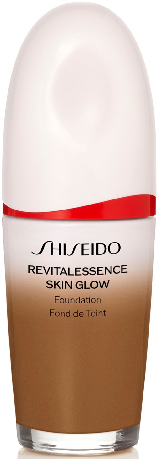 A foundation bottle from Shiseido, with a gradient brown base, white top, and red accent band.