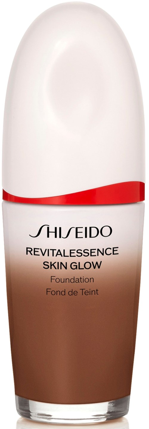 A bottle of Shiseido Revitalessence Skin Glow foundation with a white cap and a brown liquid inside.